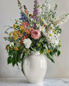 Glossy Ceramic Vase with a Bouquet of Flowers Mockup