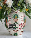 Glossy Ceramic Vase with a Bouquet of Flowers Mockup