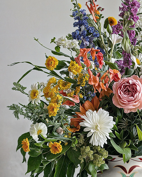 Glossy Ceramic Vase with a Bouquet of Flowers Mockup