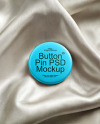 Round Button Pin on a Shiny Silk Fabric Mockup