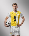 A Man with a Ball Wearing a V-Neck Soccer Jersey and Shorts Mockup