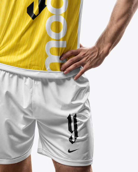 A Man with a Ball Wearing a V-Neck Soccer Jersey and Shorts Mockup