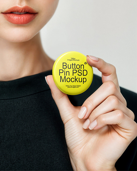 Woman Holding Round Button Pin in a Hand Mockup