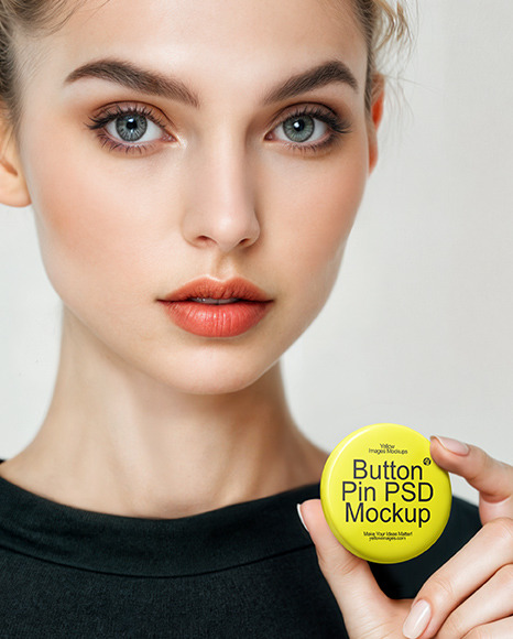 Woman Holding Round Button Pin in a Hand Mockup