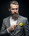 Bearded Man in Tweed Jacket Pointing to a Pin-Back Button Mockup