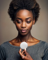 African Woman Holding a Button Pin Mockup