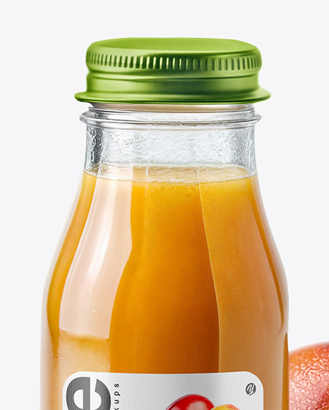 A Bottle of Mango Juice with Mango Pieces and Green Leafs Mockup