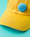 Round Button Pin on a Yellow Baseball Cap Mockup