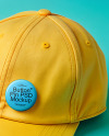 Round Button Pin on a Yellow Baseball Cap Mockup