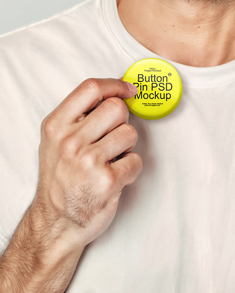 Man Wearing a T-Shirt and Beanie Hat Holding a Button Pin Mockup
