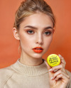 Young Woman Holding a Pin-Back Button Mockup
