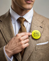 Man Wearing Tweed Jacket Point at Pin-Back Button Mockup