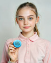 Young Girl Holding a Button Pin Mockup
