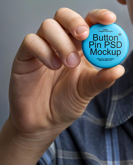 Teenage Boy Holding a Pin Button Mockup