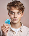 Teenage Boy Holding a Pin Button Mockup