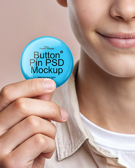 Teenage Boy Holding a Pin Button Mockup