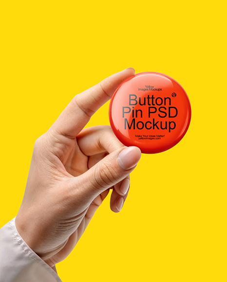 Hand Holding a Pin-Back Button Mockup