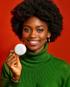 Black Woman Holding a Pin-Back Button Mockup