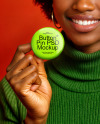 Black Woman Holding a Pin-Back Button Mockup