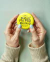 Two Female Hands Holding a Pin-Back Button Mockup