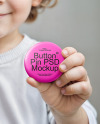 Little Child Holding a Pin Button Mockup
