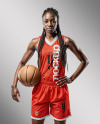 Black Woman with Braids Wearing a V-Neck Basketball Jersey and Shorts Mockup