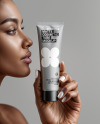 Black Woman Holding Cosmetic Tube in a Hand Mockup