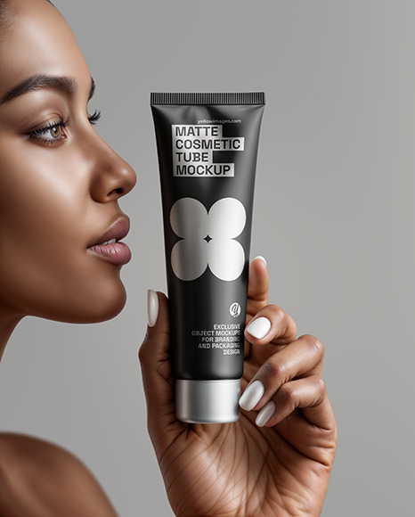Black Woman Holding Cosmetic Tube in a Hand Mockup