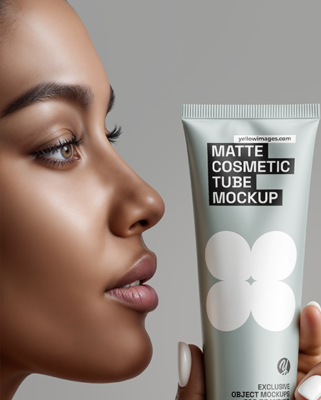 Black Woman Holding Cosmetic Tube in a Hand Mockup