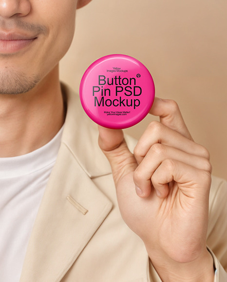 An Asian Man Holding a Button Pin Mockup