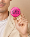 An Asian Man Holding a Button Pin Mockup