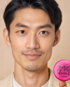 An Asian Man Holding a Button Pin Mockup