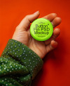 Female Hand Holding a Pin-Back Button Mockup