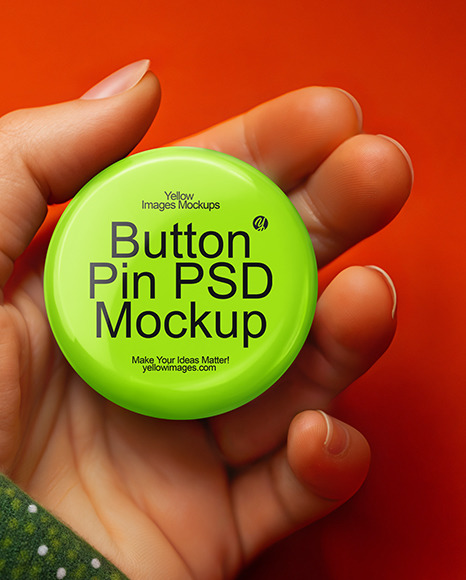 Female Hand Holding a Pin-Back Button Mockup