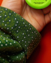 Female Hand Holding a Pin-Back Button Mockup