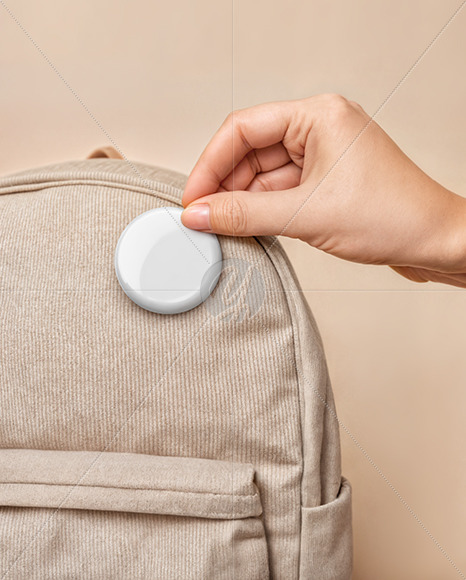 Hand Putting a Button Pin on a Backpack Mockup