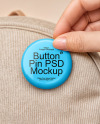 Hand Putting a Button Pin on a Backpack Mockup