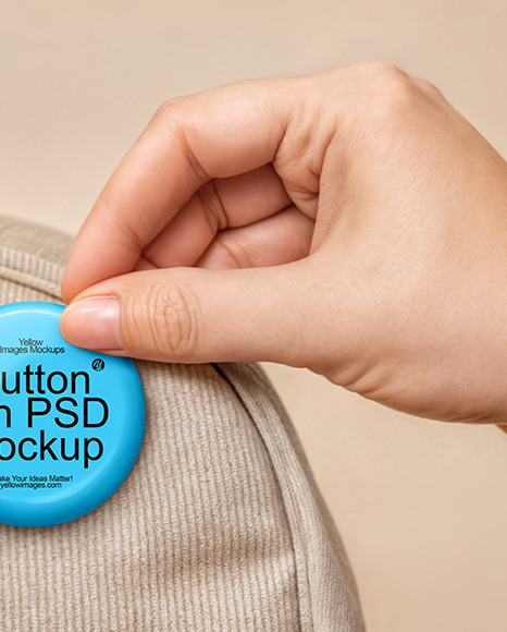 Hand Putting a Button Pin on a Backpack Mockup