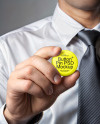 A Man with a Tie Holding a Button Pin Mockup
