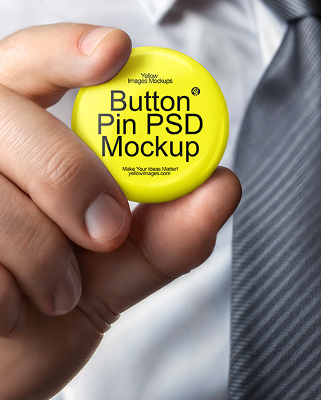 A Man with a Tie Holding a Button Pin Mockup
