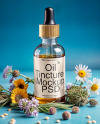 Oil Tincture Dropper Bottle with Herbs and Blue Background Mockup