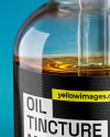 Oil Tincture Dropper Bottle with Herbs and Blue Background Mockup