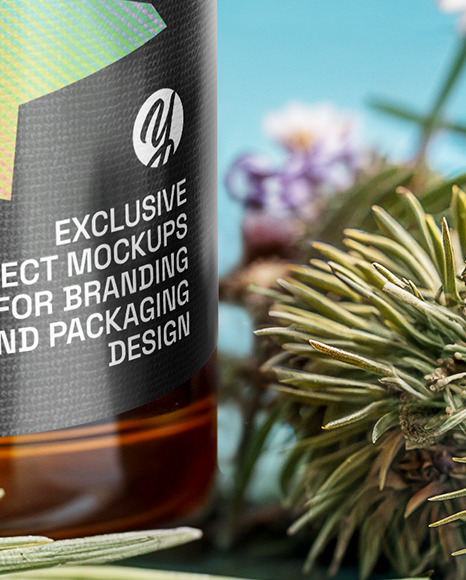 Oil Tincture Dropper Bottle with Herbs and Blue Background Mockup