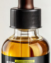Oil Tincture Dropper Bottle on a Wooden Plate with Herbs Mockup