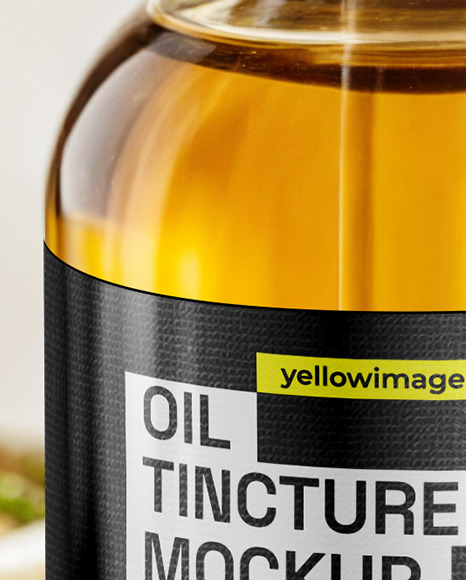 Oil Tincture Dropper Bottle on a Wooden Plate with Herbs Mockup