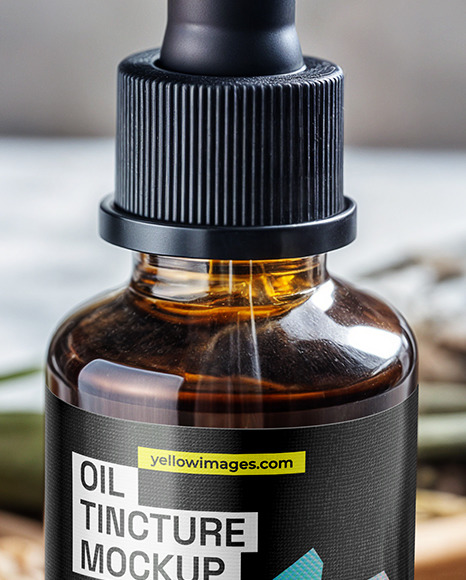 Amber Dropper with Oil Tincture on a Wooden Plate with Dry Herbs Mockup