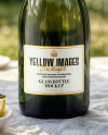 Green Glass Champagne Bottle on a Tablecloth Mockup