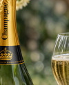 Green Glass Champagne Bottle on a Tablecloth Mockup