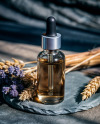 Oil Tincture Dropper Bottle on a Stone Plate with Herbs Mockup