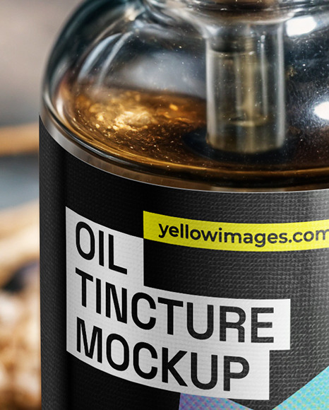Oil Tincture Dropper Bottle on a Stone Plate with Herbs Mockup
